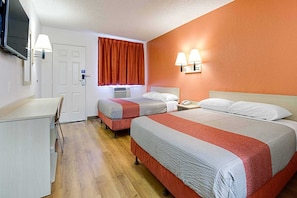 A hotel room with two beds, a desk, a television, and a window with curtains. - 2 Full Beds | Tempe, AZ (Tempe)