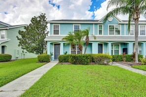A two-story residential building with a front entrance, a covered porch, and a well-maintained lawn. - Pool Access! Steps from Upper Tampa Bay Trail (Tampa)