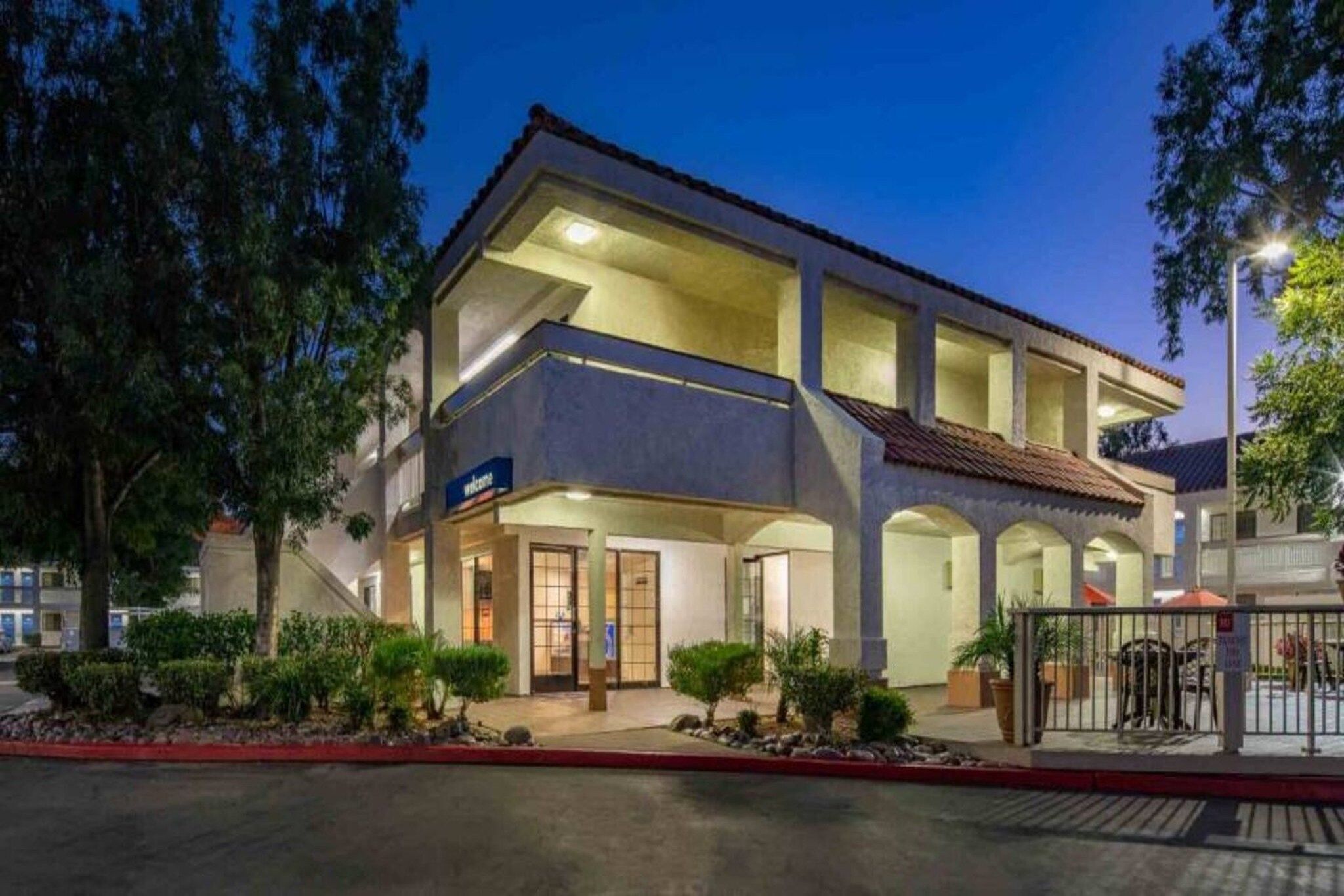 A two-story building with a flat roof and a welcoming entrance.