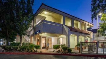 A two-story building with a flat roof and a welcoming entrance.