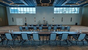 A conference room with a long table and chairs, large windows, and modern lighting fixtures. - Pet-Friendly Guest Room w/ Wet Bar | Nr Park City (Heber City)