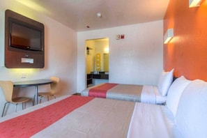 A hotel room with two beds, a desk, and a chair. - 2 Full Beds | ADA/Tub Non-smoking (Chula Vista)