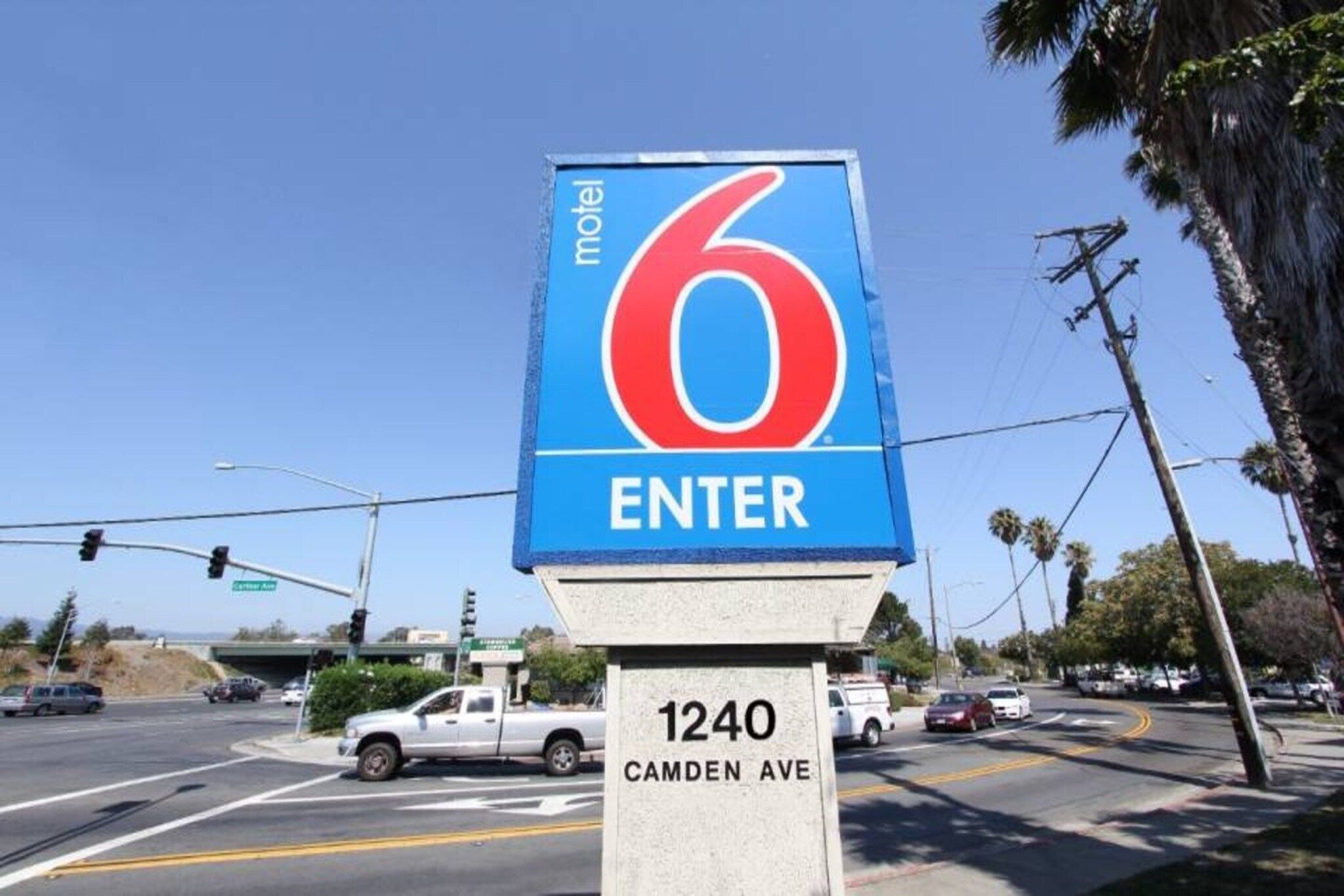A motel sign with the number 6 and the word 'ENTER' on it, located at 1240 Camden Ave.