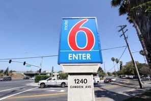 A motel sign with the number 6 and the word 'ENTER' on it, located at 1240 Camden Ave.