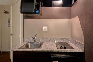 A kitchen with granite countertops, stainless steel sink, and a dishwasher. - Cozy King Bed Room|Fridge|Free WiFi (Gilroy)