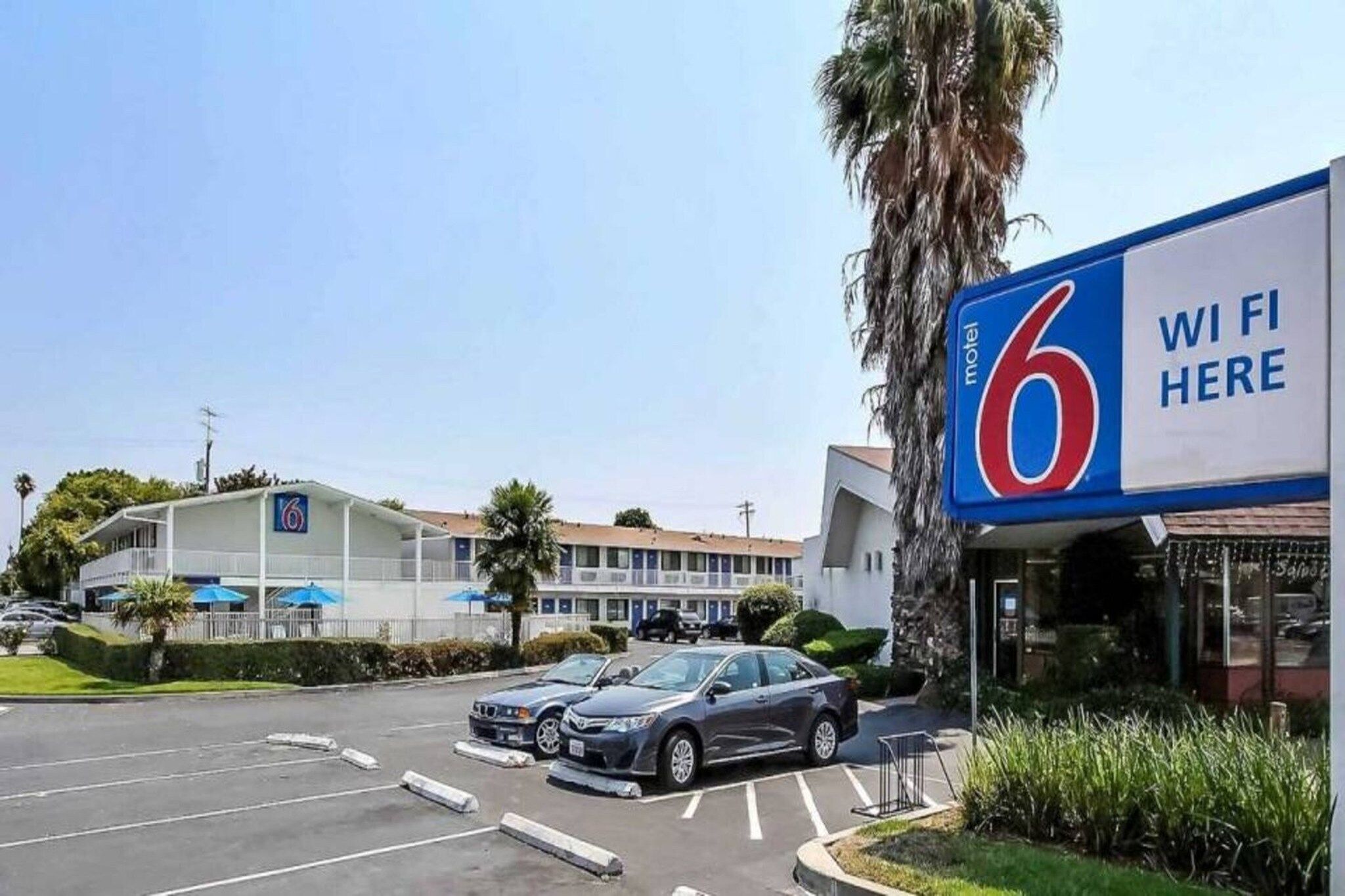 A motel with a prominent sign indicating WiFi availability.