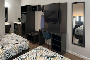 A hotel room with two beds, a desk, a chair, a TV, and a wardrobe. - 2 Full Beds | Non-Smoking, Kitchen (Vicksburg MS)