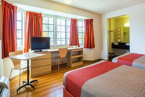 A hotel room with a desk, chair, two beds, and a television. - 2 Queen Beds | Premium, Micfridge (Yuma AZ)