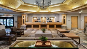A lobby with a reception desk, seating area, and a check-in counter. - Experience the Ultimate Family Getaway at Sheraton Mountain Vista's 2-Bd Lockoff (Avon)