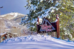 A snowy landscape with a sign for Timber Run. - Hot Tubs and Pool -looping Shuttle- Cozy Fireplace (Steamboat Springs)