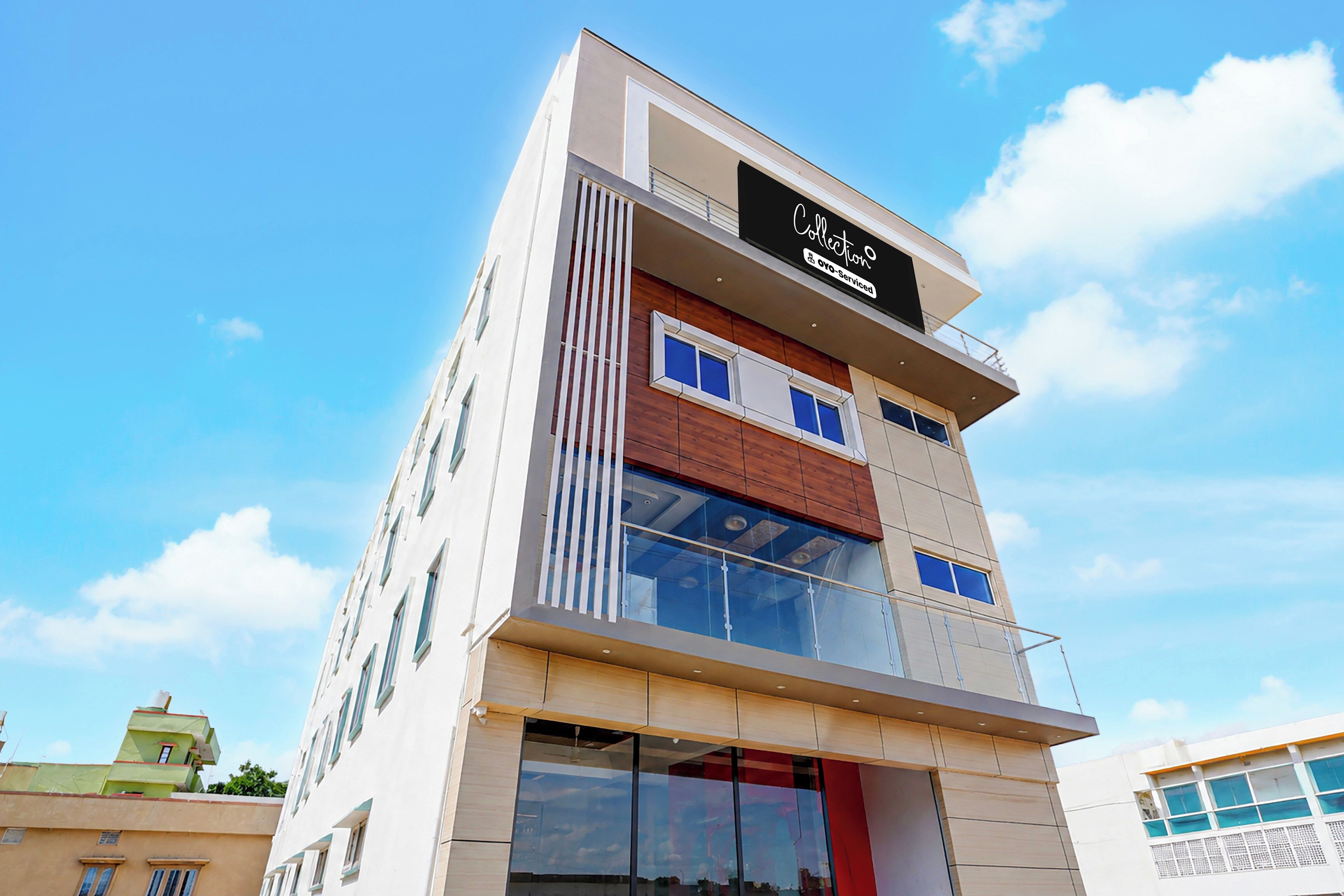 A multi-story building with a prominent sign at the top.