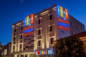A hotel with a prominent 'EWAH EXPRESS HOTELS' sign. - Ewaa Express Hotel - Gaber Riyadh (Riyadh)