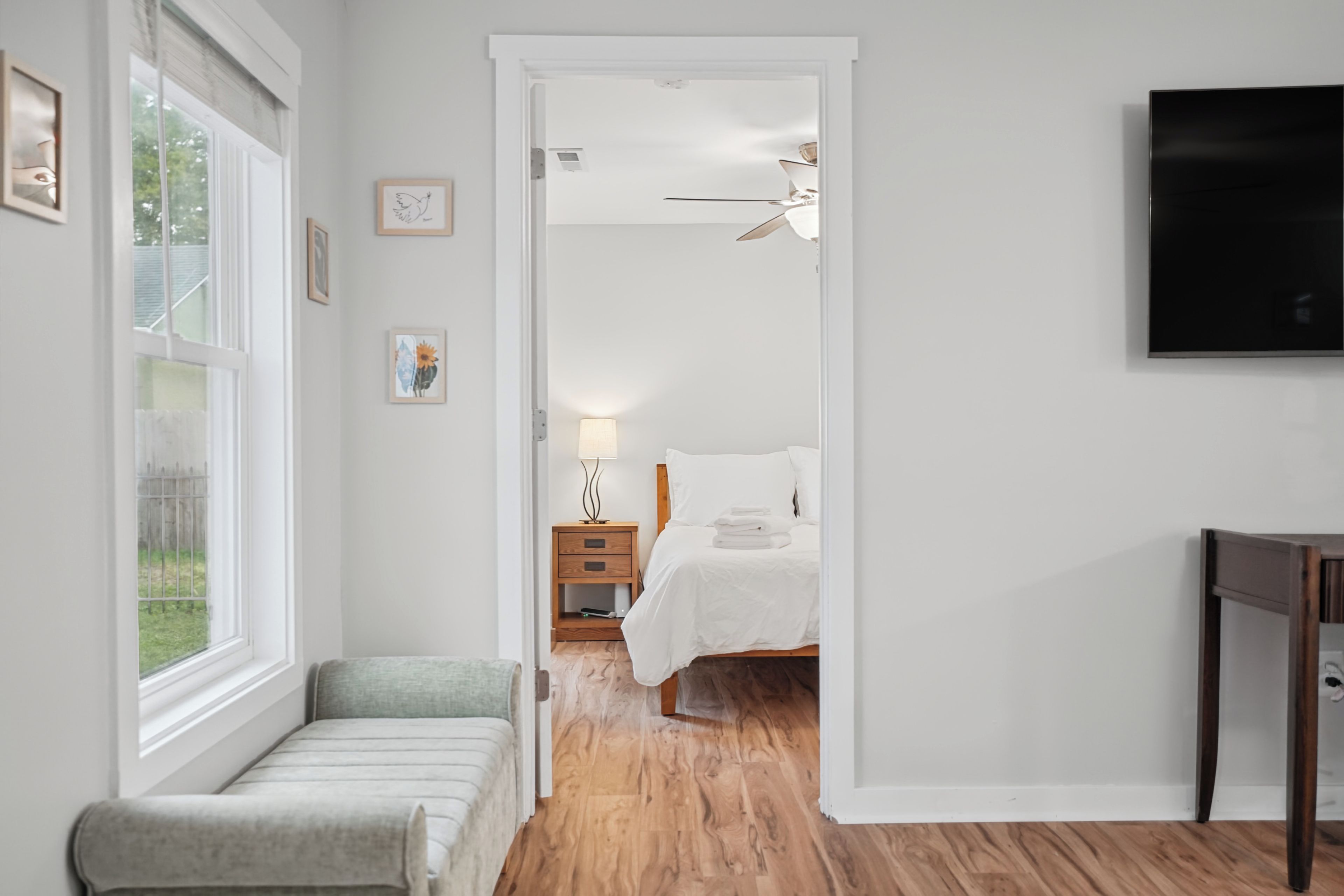 A quiet hallway leads you home to a bright, restful bedroom just steps away.