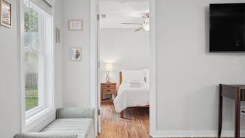 A quiet hallway leads you home to a bright, restful bedroom just steps away.