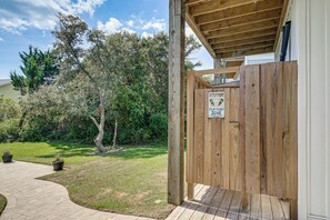 A wooden deck with a sign indicating a proper footwear area. - Stroll to Beach! Family Surf City Home w/ Views (Holly Ridge)