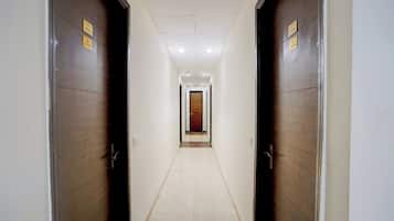 A corridor with two doors on each side, each marked with a room number.