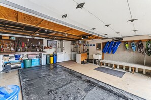A garage with a workbench, tools, and storage cabinets. - Silverthorne Mountain Retreat Hot Tub Sauna Near Keystone Breck and Copper (Silverthorne)