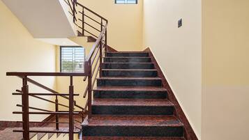 A staircase with a handrail and a landing area.