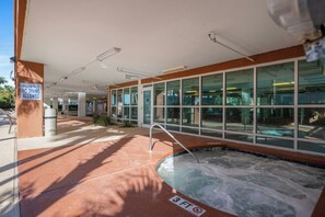 A pool area with a sign indicating shallow water and no diving allowed. - Malibu Pointe 1001 -I/O Pools-Lazy River-4BR/4BA (North Myrtle Beach)