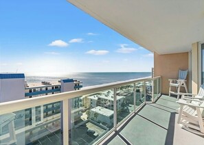 A balcony with a view of the sea and buildings. - Malibu Pointe 1001 -I/O Pools-Lazy River-4BR/4BA (North Myrtle Beach)