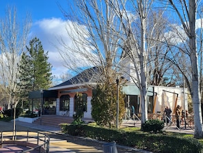 A building with a modern architectural style, featuring a glass facade and a brick exterior.