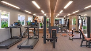 A gym with treadmills, weight machines, and dumbbells. - Cozy apartment in Barra Olímpica, close to the beaches. (Rio de Janeiro)