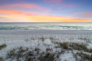 A beach with a clear sky and ocean. - Coastal View | Gulf Views | Pool & Hot Tub (Inlet Beach)