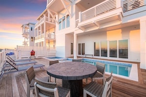 A deck with a pool, outdoor furniture, and a barbecue grill. - Coastal View | Gulf Views | Pool & Hot Tub (Inlet Beach)