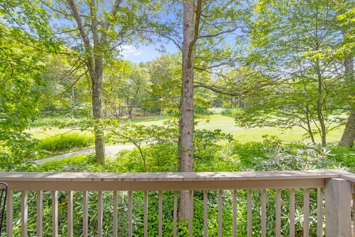 Back Deck: Enjoy views overlooking the 12th hole of the Devils Knob Golf Course, along with comfortable outdoor seating and an electric grill.