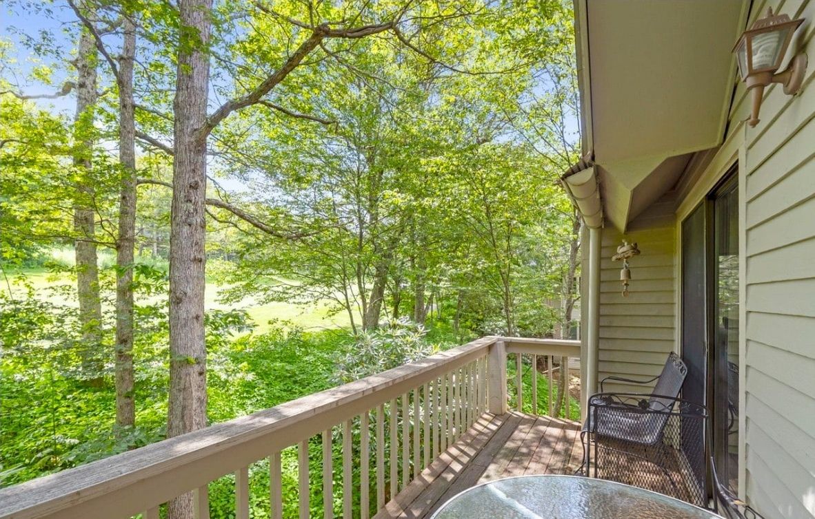 Back Deck: Enjoy views overlooking the 12th hole of the Devils Knob Golf Course, along with comfortable outdoor seating and an electric grill.