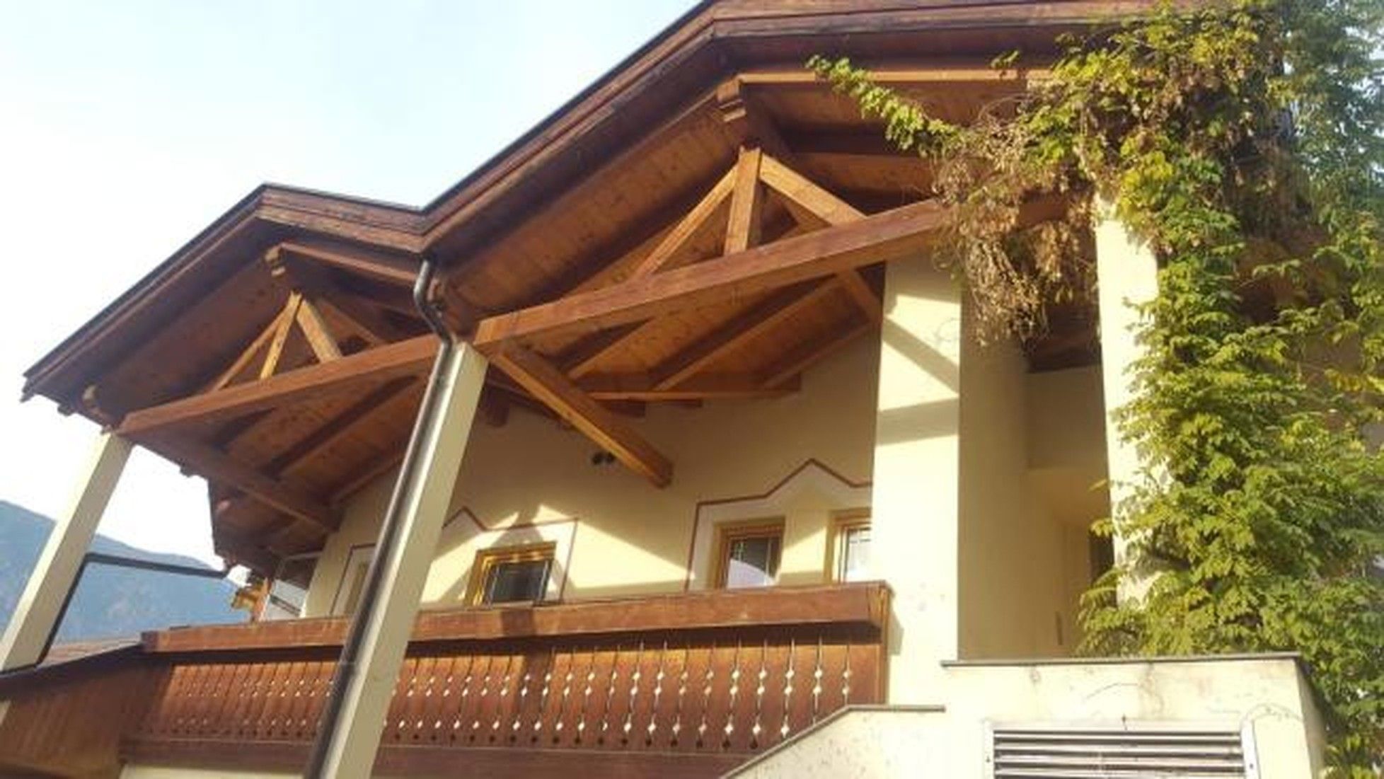 A building with a wooden balcony and a window.