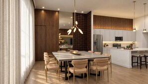 A modern kitchen with a central island, stainless steel appliances, and pendant lighting. - 15BR house with private pool in Sonoma Resort (Kissimmee)