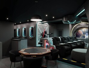 A room with a gaming table, multiple gaming chairs, a large illuminated wall display, and a futuristic design. - 15BR house with private pool in Sonoma Resort (Kissimmee)