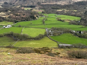 A rural landscape with fields, stone walls, and scattered buildings. - Pandora (Holmrook)