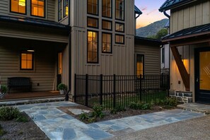 A two-story building with a stone pathway leading to a porch. - Balsam Preserve Private Golf Resort | Luxury w/ Mtn Views (Sylva)