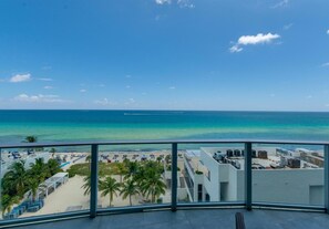 A balcony with a view of a beach and ocean. - Panoramic Ocean View Entire Rental Unit - 2bed/2bath Hotel Suite, Hollywood, FL (Hollywood)