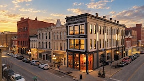 A street view of a downtown area with historic buildings, a prominent 'Mason & Mason' store, and parked cars. - Stunning Penthouse | Luxe • Sleeps 19 • Downtown! (Frankfort)