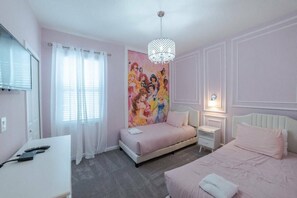 A bedroom with a bed, bedside tables, a desk, and a wall with a colorful mural. - 8BR Themed Home Near Disney Pool & Game Room (Kissimmee)