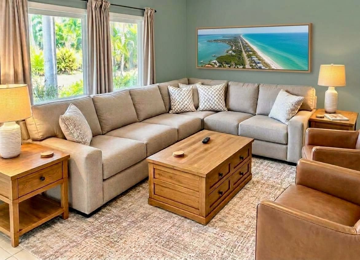 Comfy living area with stone fireplace and 65” QLED Smart TV