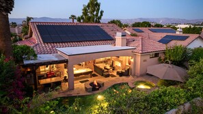 A residential property with a covered patio, outdoor seating area, and a swimming pool. - Pool, Spa & Game Patio Oasis in Indian Wells (Indian Wells)