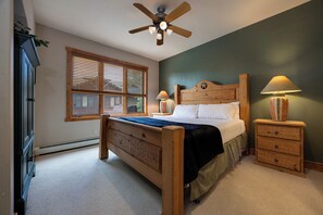 Sink into the plush bed after a day of adventure, with warm wood accents and a ceiling fan to keep you comfortable year-round. - WS2748 | Winter Shuttle | Hot Tub | Pool | Gas Fireplace (Steamboat Springs)