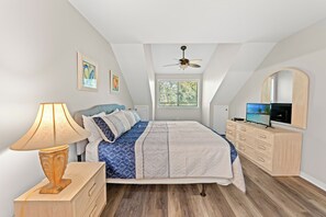 A bedroom with a bed, a dresser, a television, a ceiling fan, and a window. - W Hyde Pk 11E in Kingston 2nd floor, Pool, Beach (Myrtle Beach)