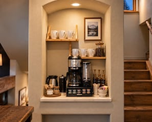 A coffee station with a Keurig coffee maker, cups, and condiments. - Downtown luxury retreat, Lake and MTN views, Yoga (Grand Lake)
