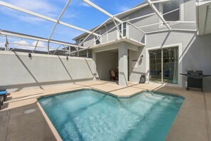 A rooftop swimming pool with a glass enclosure, a covered patio area, and a barbecue grill. - Magical Getaway With Private Pool Top Location (Davenport)