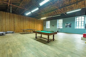 A spacious indoor area with a pool table, ping pong table, and exercise equipment. - Exclusive Estate - La Chapelle aux Acacias (Caucalières)