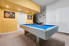 Enjoy a game of pool or shoot hoops on the basketball arcade game. It's a fun spot to spend time together between outings. - Orange Haven Oasis | Pool, Spa & Game Room (Davenport)