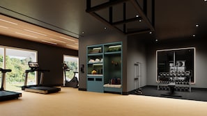 A modern gym with exercise equipment, a wall-mounted rack with kettlebells, and a view of greenery outside. - Las Villas Marina Pez Vela  (Provincia de Puntarenas)