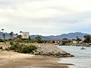 A coastal landscape with a beach, mountains, and a bridge. - WINTER ESCAPE- PET-FRIENDLY 3BD+OFFICE NEAR GOLF COURSES, RIVER AND CASINOS (Mohave Valley)