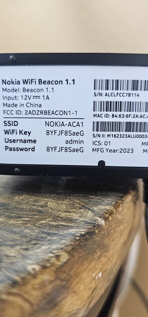 Ein Nahaufnahmebild eines Nokia WiFi Beacon 1.1 Etiketts mit technischen Details.