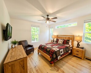 A bedroom with a bed, a chair, a desk, and a ceiling fan. - 5-BR 4-BA Modern Rustic house on 5.5 acres. 25-30 min from Blue Ridge or Ellijay (Cherry Log)